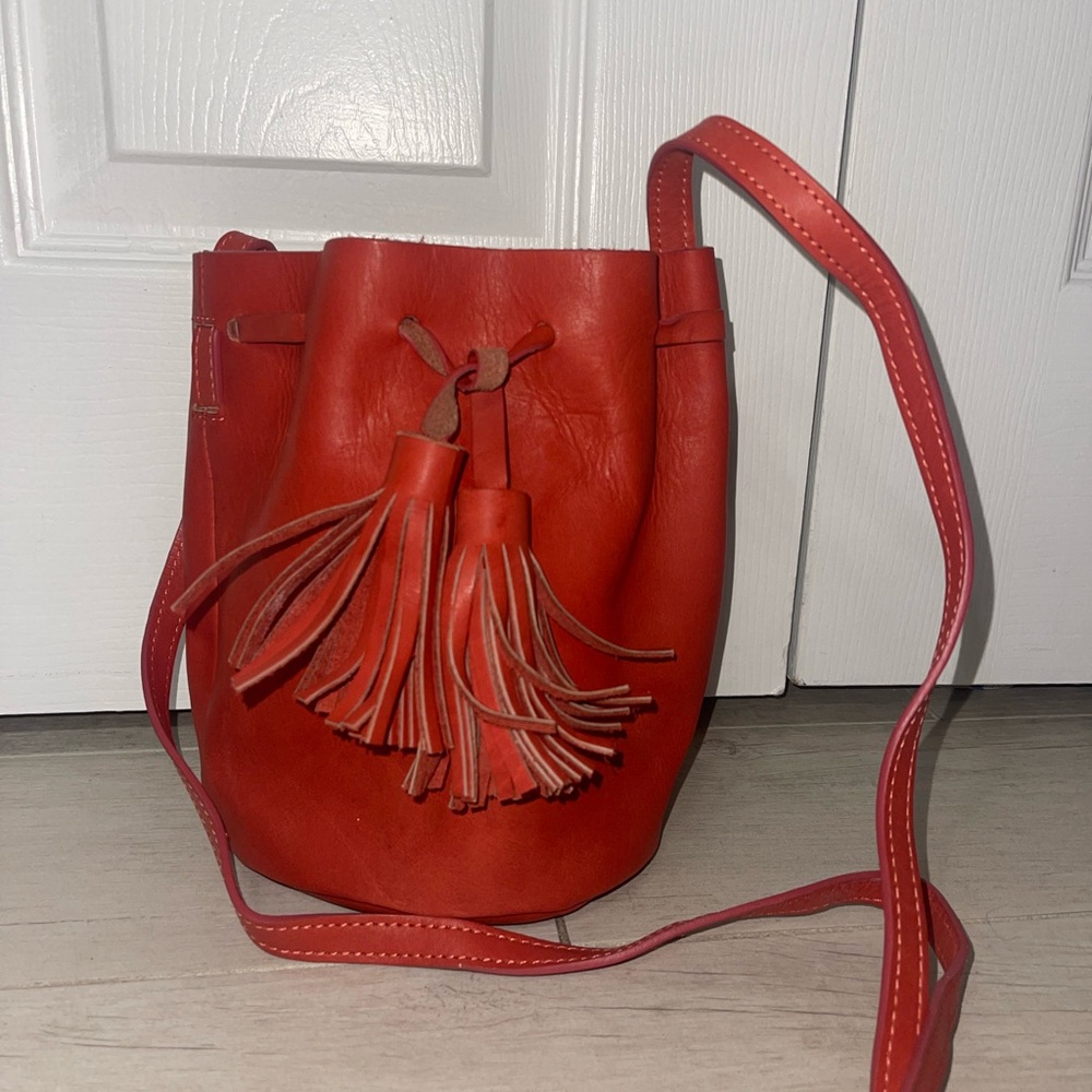 7 Chi Red bucket bag with tassel